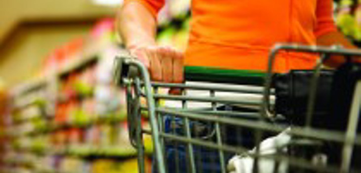 customer pushing a trolley in supermarket